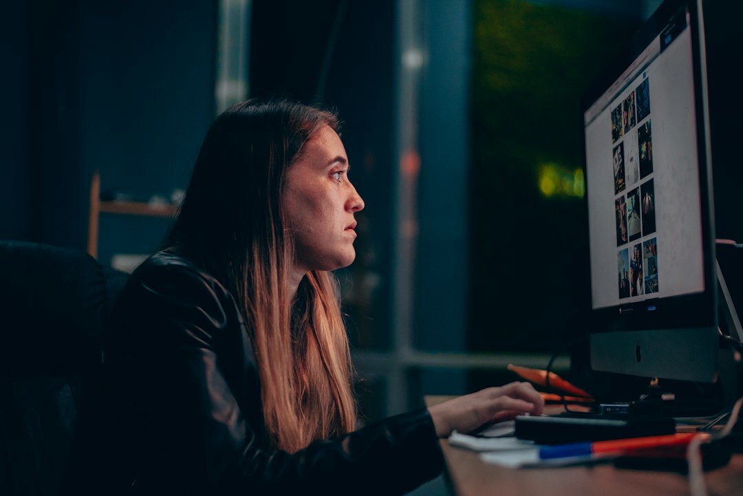 woman editing video on computer